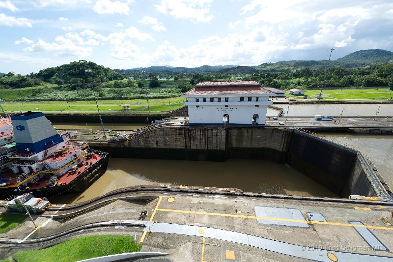 20101204_152559 D3S.jpg - Miraflores Locks, Panama Canal.  6 minutes later it has been lowered 27 feet and will be heading out toward the Pacific